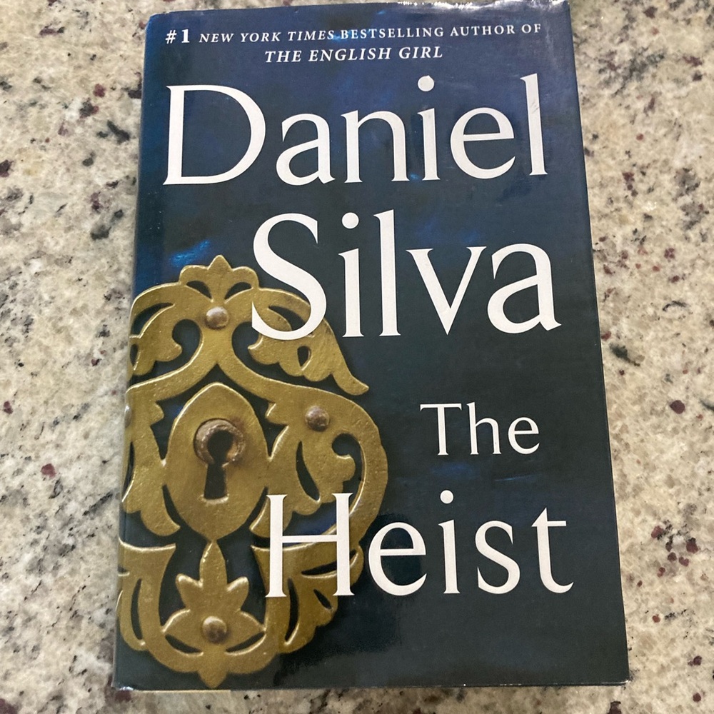 Preowned The Heist by Daniel Silva in hardcover